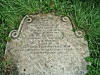 Headstone fallen flat, fortunately with the inscription up